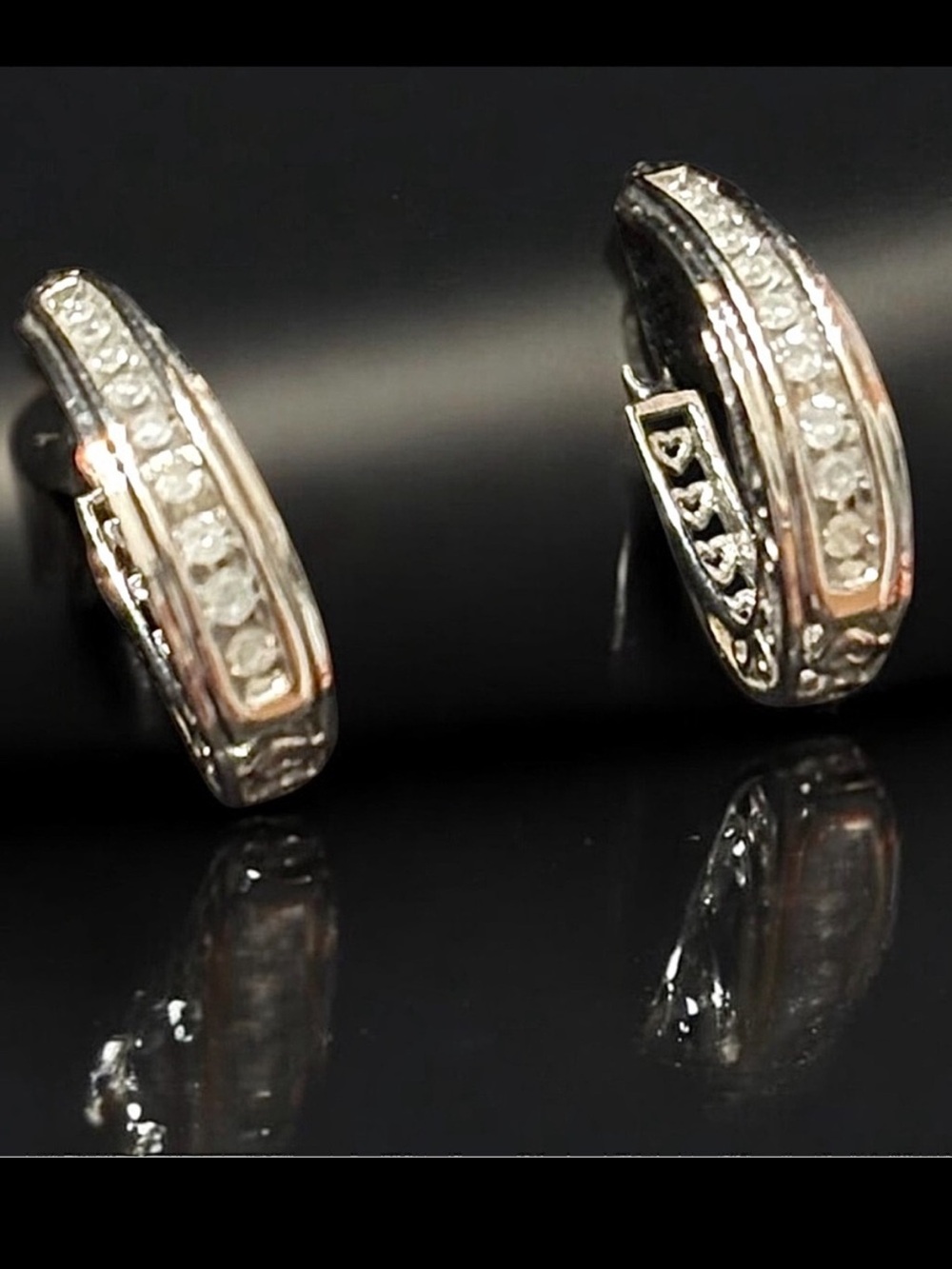 Channel set CZ’s and delicate silver filagree really make these earrings shine.